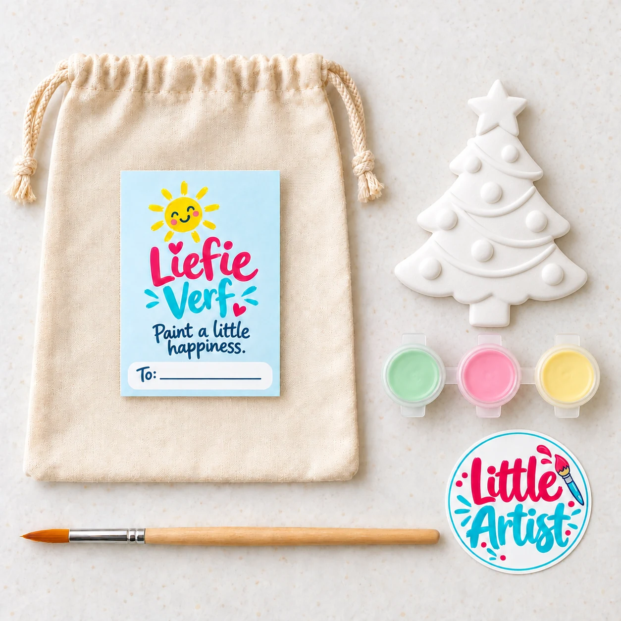 Christmas tree paint-your-own party bag with plaster figure, three paint pots, brush, sticker and drawstring bag